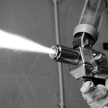Flame spraying guns for corrosion protection